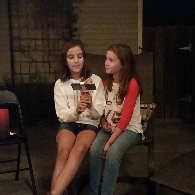 Singing karaoke in auntie Anne's backyard.