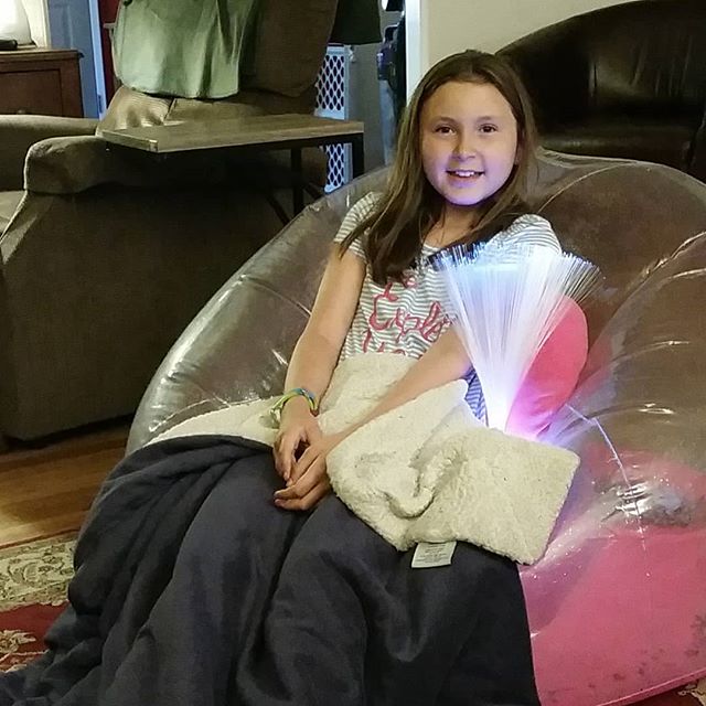 Happy girl in her inflatable chair.