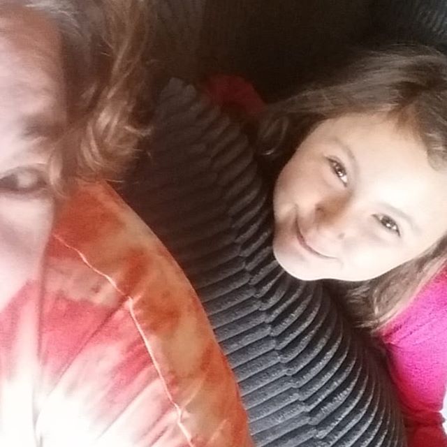 Cuddling on the couch. One walk and I have achieved beach hair. #growingoutmyhair