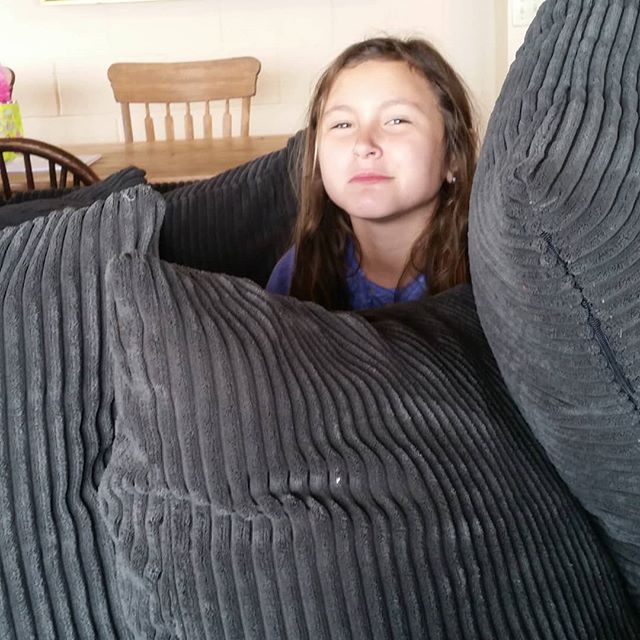 Hanging out in her pillow fort.